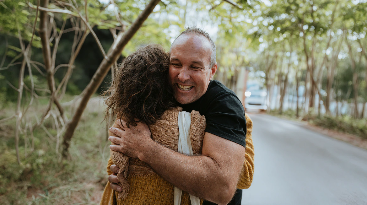 The Zenko Noosa community sharing an embrace